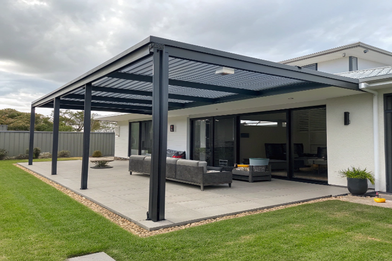 Contemporary aluminum attached pergola on modern Ipswich estate home with sleek design
